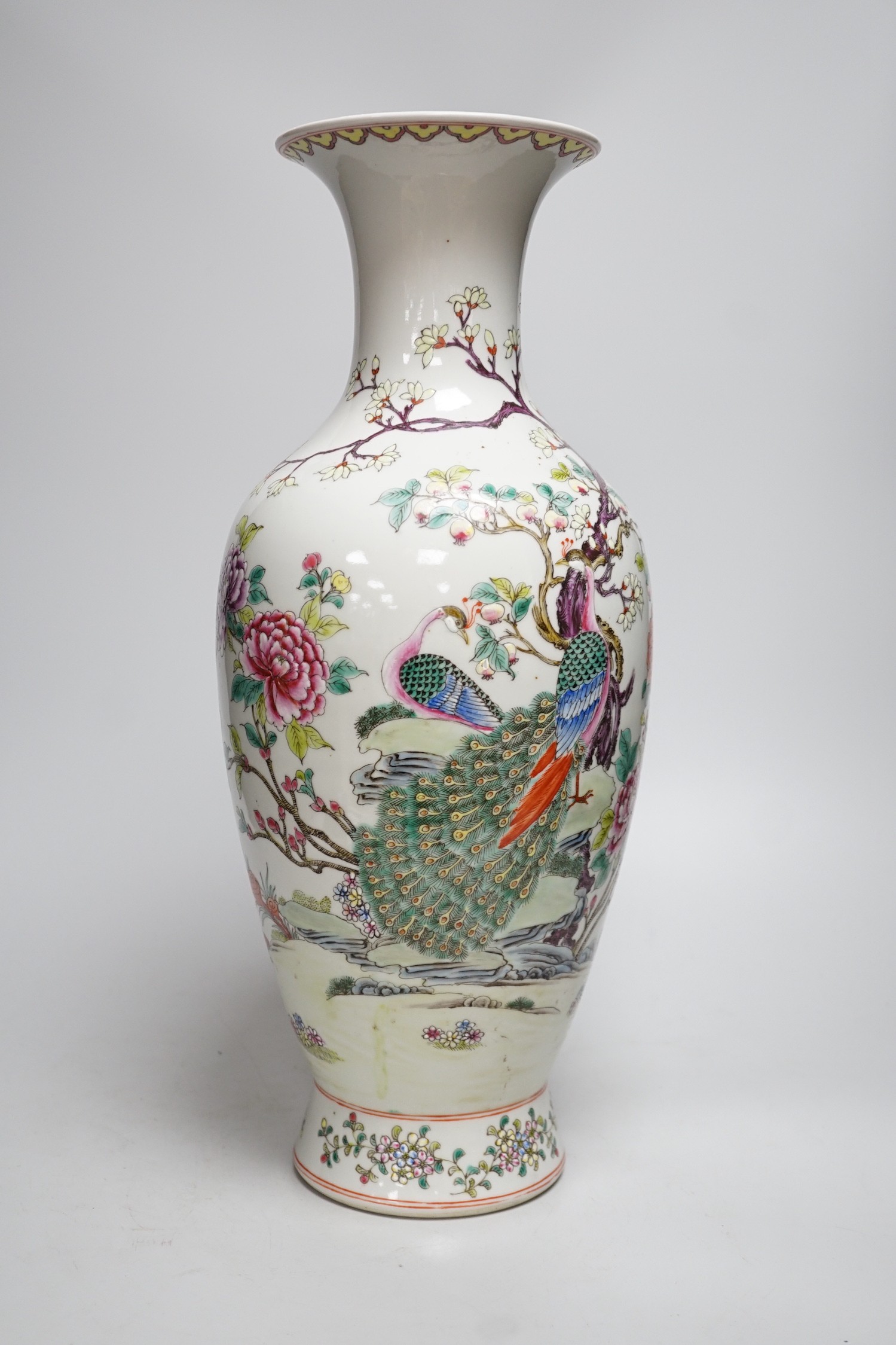 A large Chinese famille rose peacock vase. 46cm tall